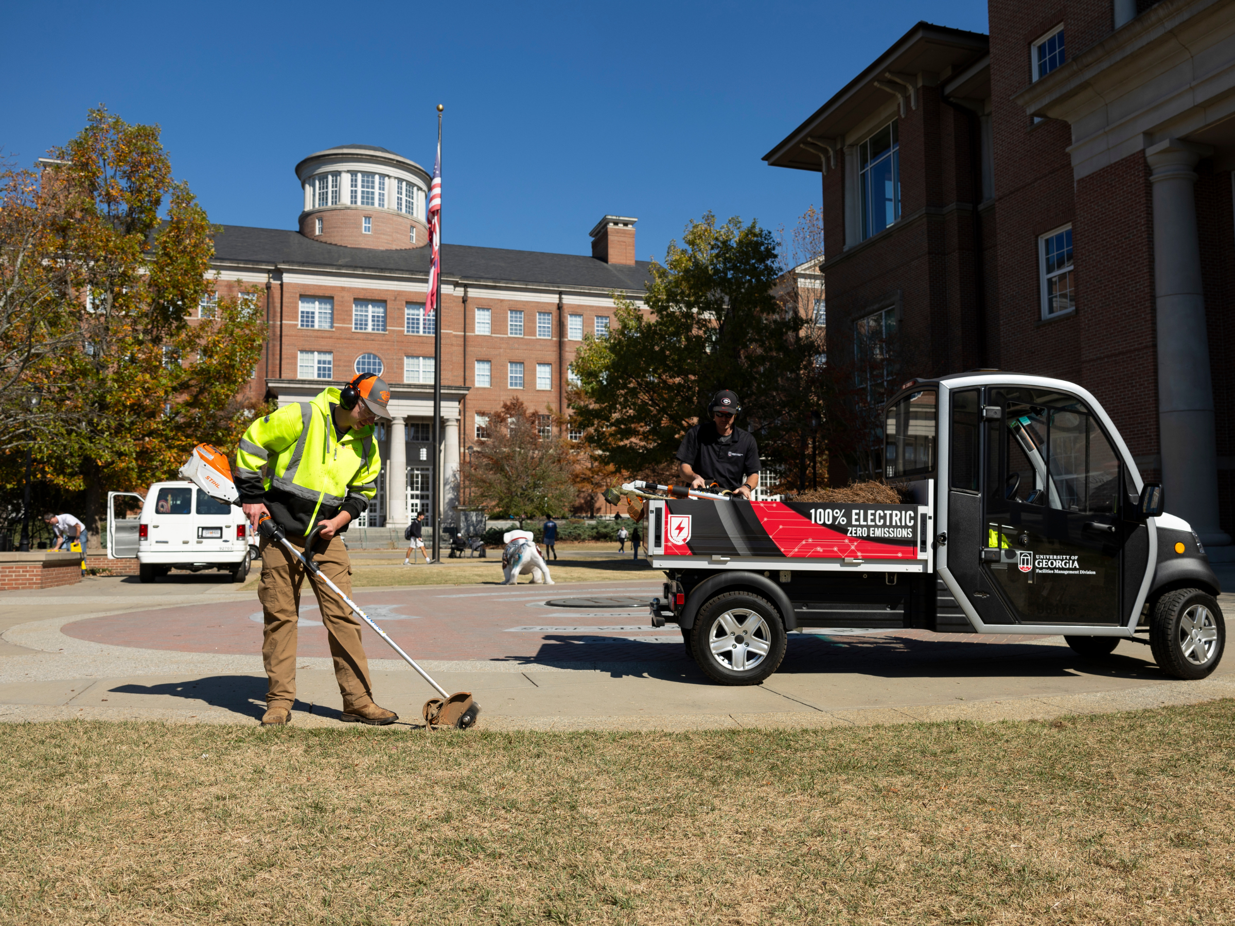 Facilities employee edging on campus